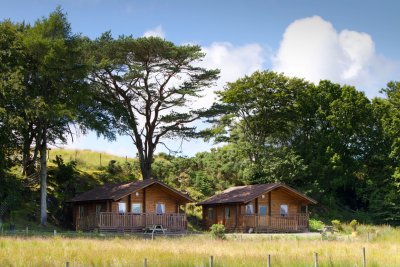 Eas and Fors Lodge setting with mature trees providing backdrop and shelter