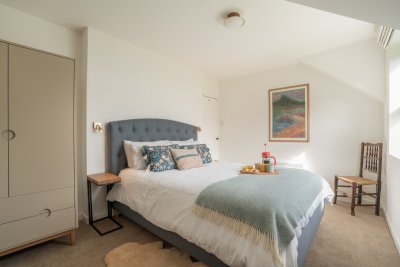 A king-sized bed awaits in the master