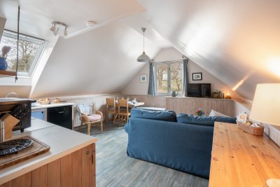 Another view of the kitchen and living area