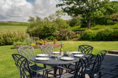 Enjoy the beautifully planted garden and patio