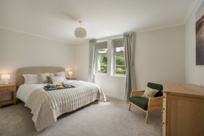 The master bedroom at Geat nan Croisean, with en-suite shower room