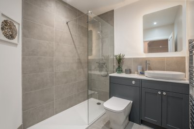 The beautifully appointed family bathroom with large walk-in shower