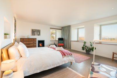 Cosy double bedroom complete with wood burning stove