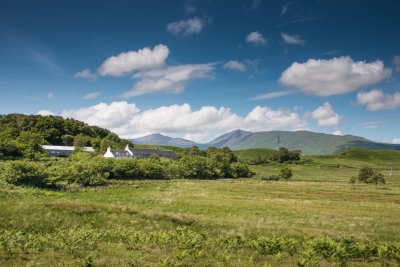 Gorsten House and the attached farmhouse with Dun da Ghaoithe in the background 