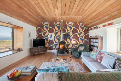 The striking feature wall was painted by artist-owner Charles Avery