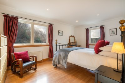 The master bedroom, complete with walk-in wardrobe and en-suite shower room