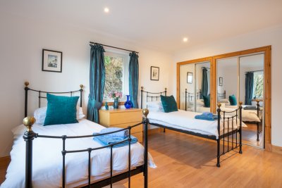 The bright and airy twin bedroom with lots of storage