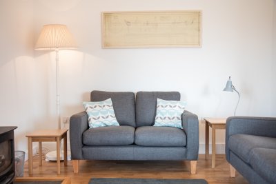 Comfortable seating and lamps in the living area