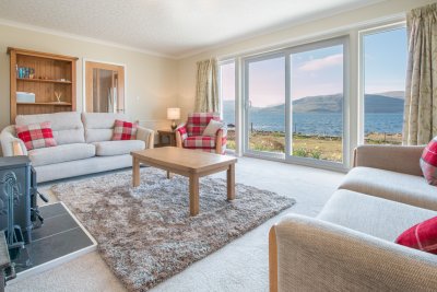 Living room with sliding doors opening to the patio