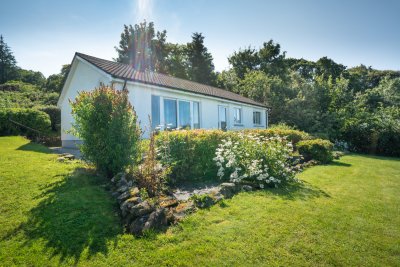 Beautiful mature gardens surround the cottage