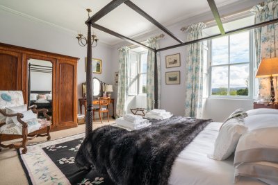 The second double bedroom of the property features an impressive four-poster bed