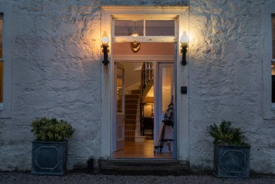 Antique lanterns light the way as you arrive at Kilfinichen House