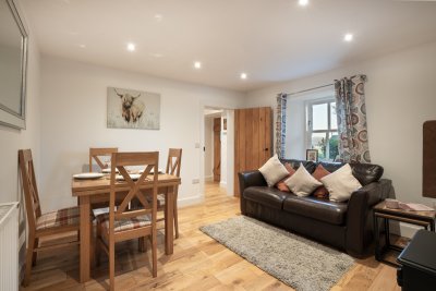 The second reception room at the cottage combines dining and living space