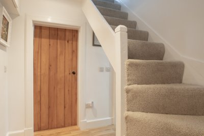 The steep winding staircase at Kilninian Cottage leading directly into twin bedroom