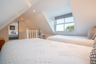 The staircase leads straight into the twin bedroom and the double bedroom leads off from this room
