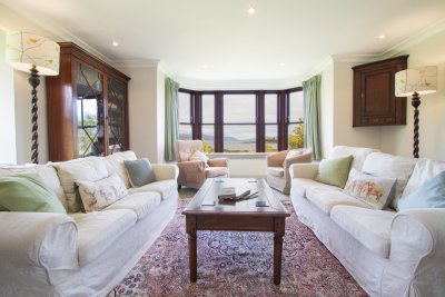 Living area with large window facing the sea