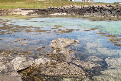 Rocky coastline interspersed with sand and pebble stretches