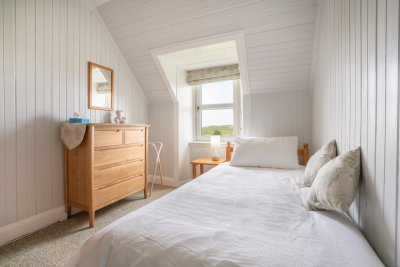 The single bedroom at Maple Cottage is a lovely light space