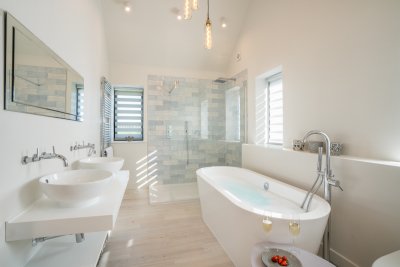 Stunning bathroom for the master suite fitted with huge walk-in shower, deep free standing bath, twin basins and w.c.