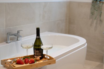 Delightful deep bath in the family bathroom, which serves the twin bedroom