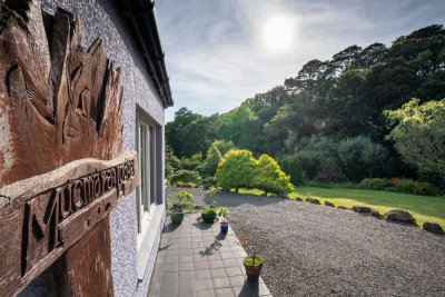 Beautiful setting of Mucmara Lodge between the village of Dervaig and the Quinish Estate