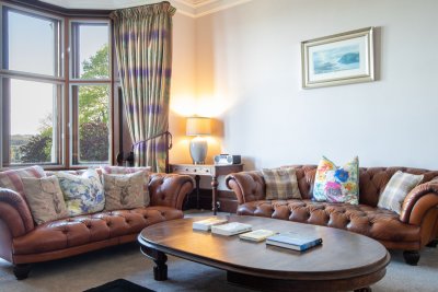 Comfortable and stylish living room at Oakfield House, filled with period details