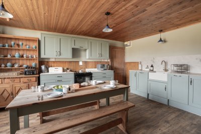 The kitchen has an open flow with character features