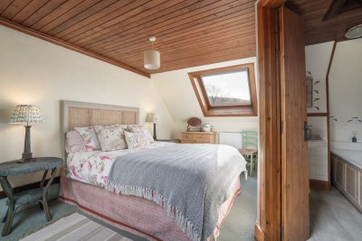 Two bedrooms and two bathrooms make the cottage ideal to share with family or friends