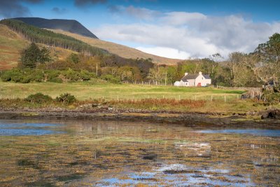 The Old Post Office seen from the shore of the bay