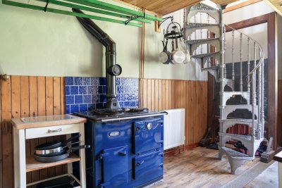 Spiral staircase leading to second bedroom