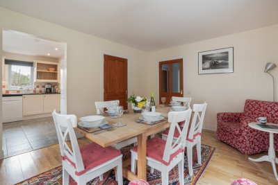 The open-plan flow from kitchen to dining ensures the chef never feels far from the action.