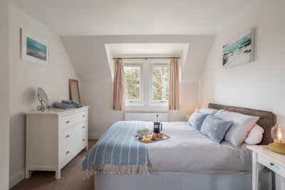 One of three inviting bedrooms at Puffin Cottage