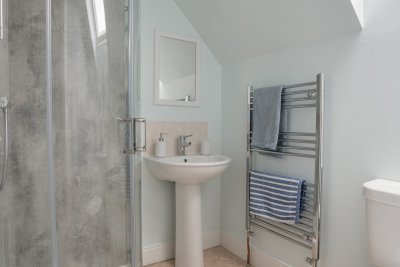 The master double bedroom offers privacy with an en-suite shower room.