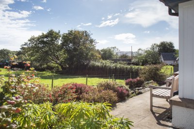 The patio offers a lovely sun trap for a drink while immersed in nature.