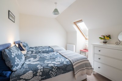 The cosy twin bedroom at Puffin.