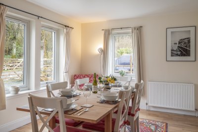 Dual aspect windows frame the dining table.