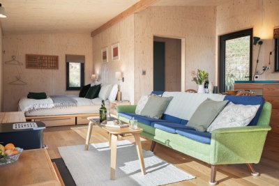 The open-plan cabin living space is cleverly designed to flow from eating to living to sleeping