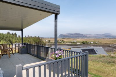 The canopied patio offers a wonderful spot to sit and watch the tides