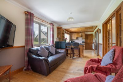 Guests will enjoy the sociable layout, with a snug sitting area in the kitchen too