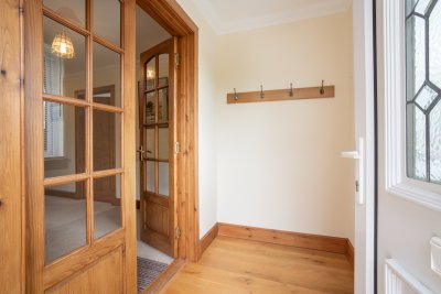 Roomy porch with plenty of space for boots and binoculars