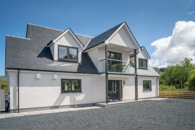 Guests can park on the driveway in front of the house which is set back from the road