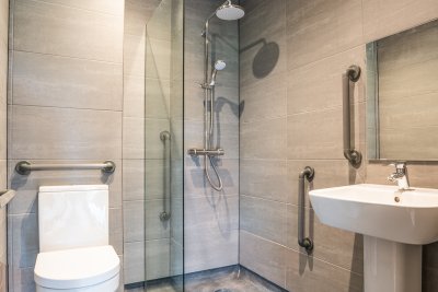 Ground floor accessible shower room with grab rails