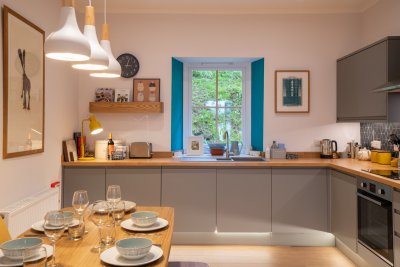 Dual aspect, the dining kitchen is filled with natural light