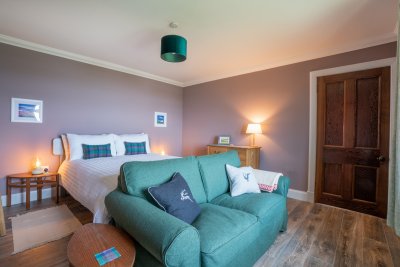 The master bedroom has space aplenty and a glorious sea view