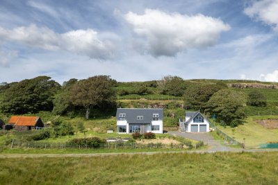 Snipe Cottage sits within a large garden with great views over the west coast