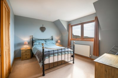 The cottage has three double bedrooms, two with sea views