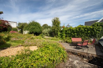 Garden with outdoor chairs and table provided