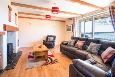 Relax in the welcoming living room at The Steading