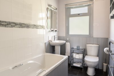 Family bathroom at The Dorran with bath and shower over