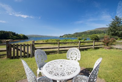 Fenced garden area around The Dorran with outdoor seating